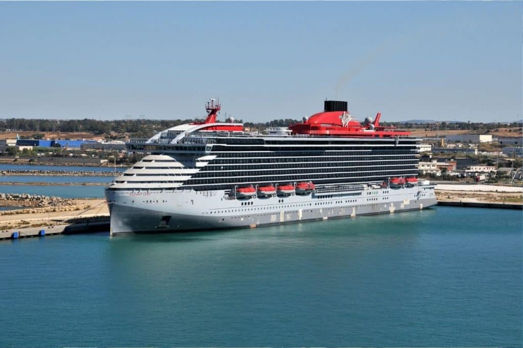 Virgin Voyages cruise ship parked in harbour